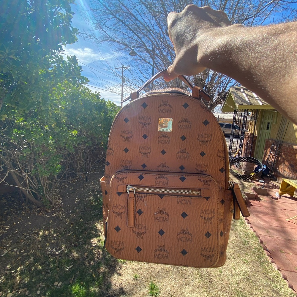 Mcm stark backpack. missing a leather leather zipper